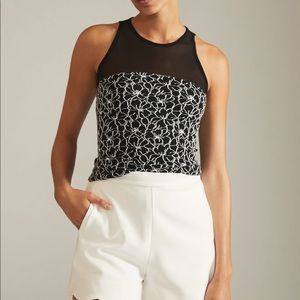 Anthropologie Mixed media black and white floral top